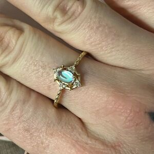 Gold and White Moonstone Ring with Ornate Design